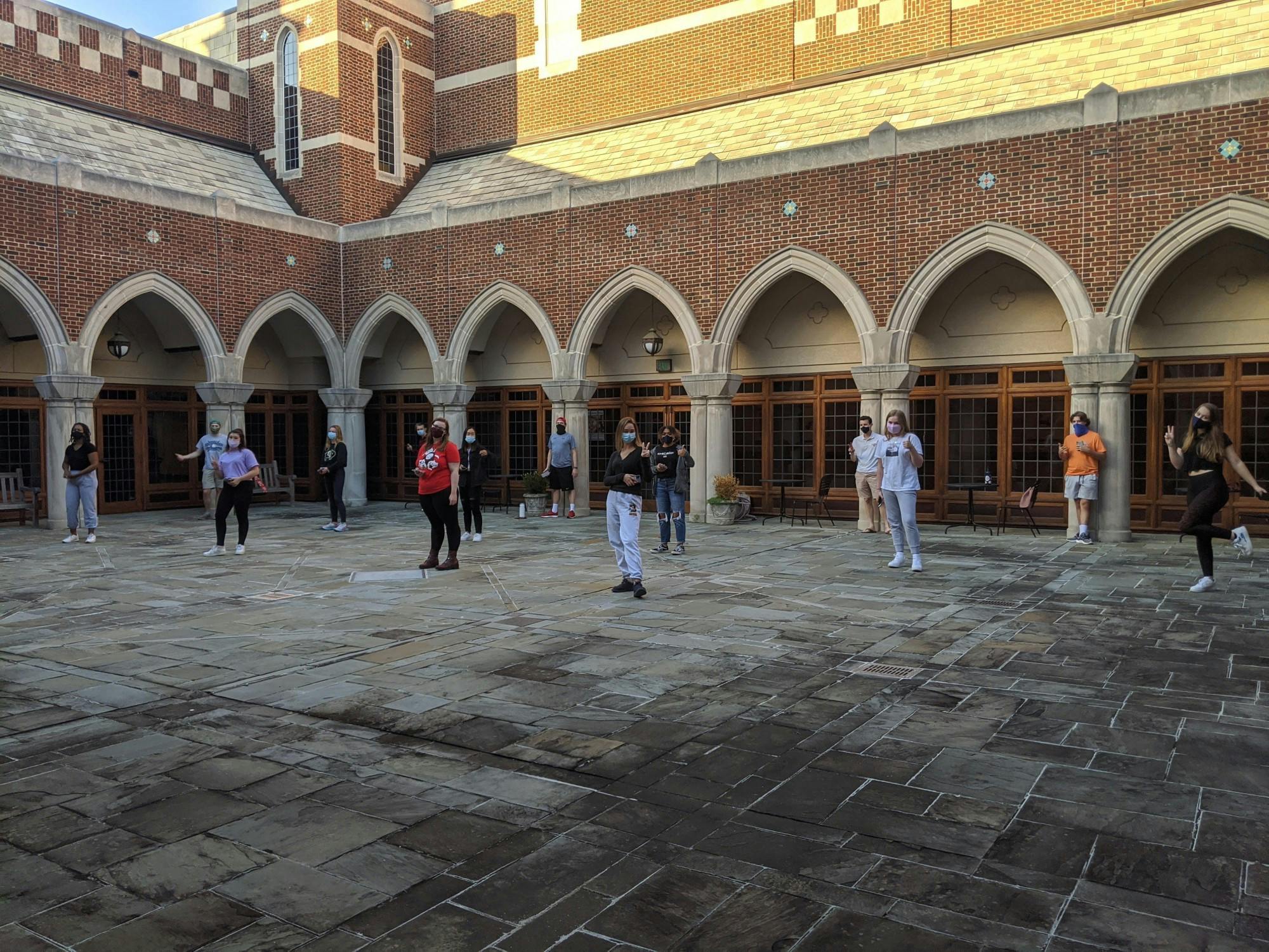 The acapella group Choeur du Roi distantly practices in masks.