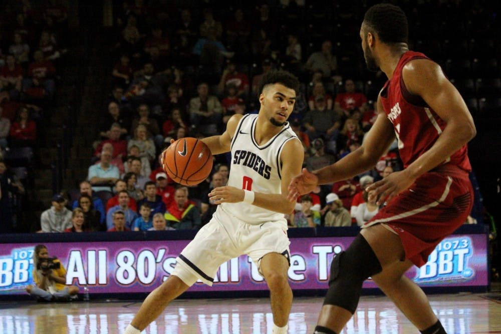 <p>Freshman guard&nbsp;Jacob Gillard looks to make a pass during the Saturday night game against Saint Joseph's.</p>