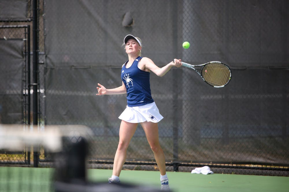 <p>Helene Heiberg swings the racket during the match against Longwood University at the Westhampton Tennis Courts on April 6.&nbsp;</p>