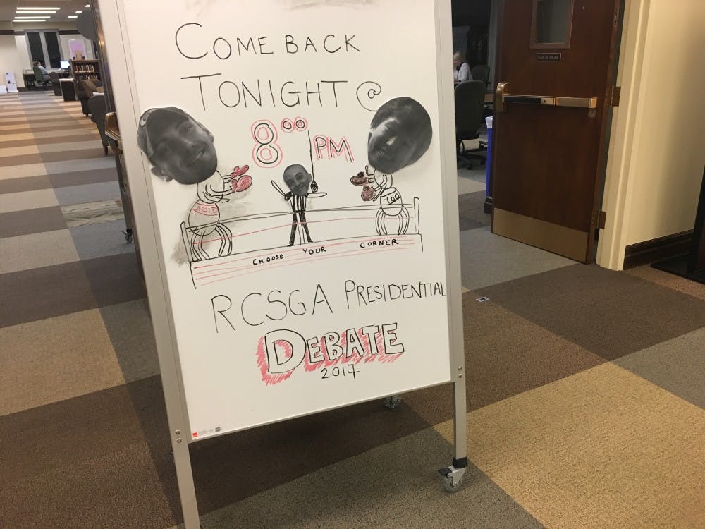 A sign in the collaborative study zone of the Boatwright Memorial Library advertising&nbsp;the RCSGA presidential debate.