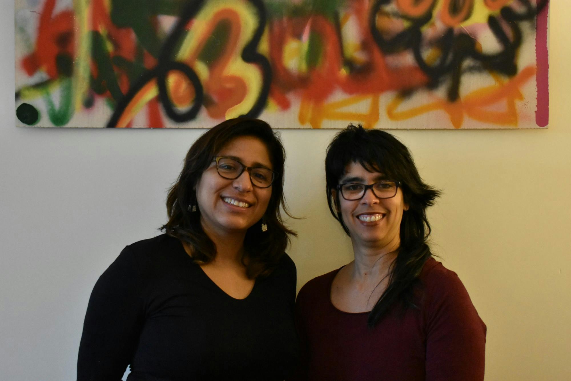 Professors Patricia Herrera (left) and Alicia Díaz pose for a portrait.&nbsp;