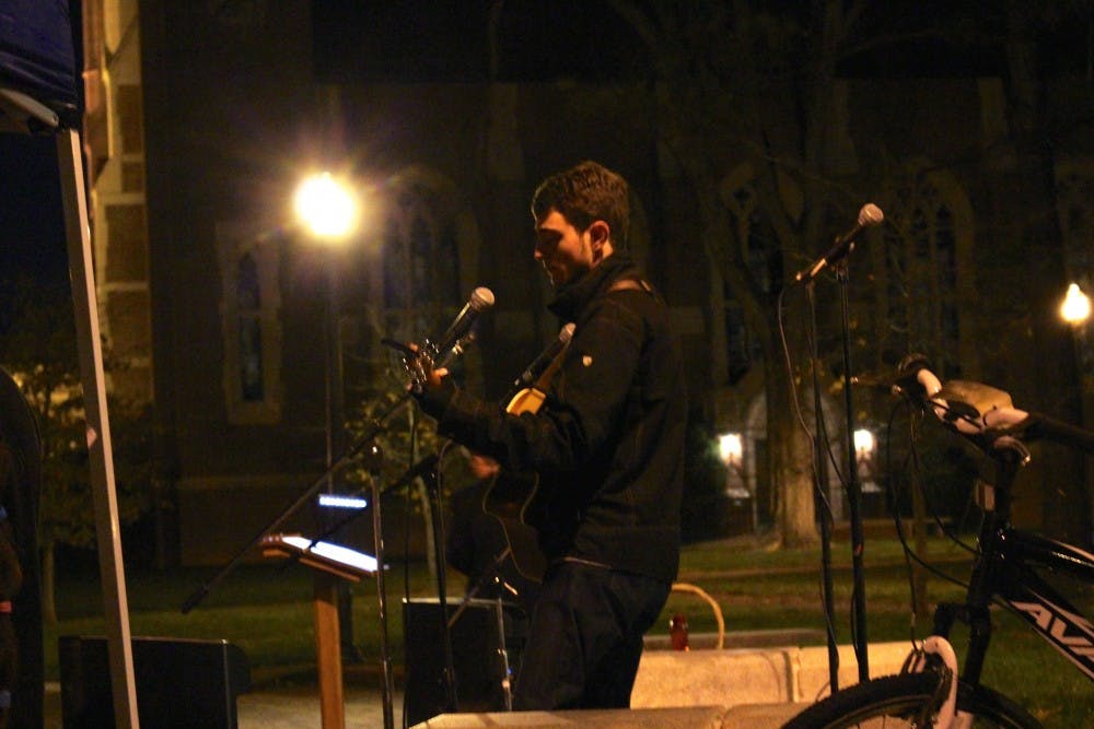 Richmond students gather on The Forum in a candlelight vigil for peace following the recent acts of terror in Paris, Beirut and around the world. Chaplain Kocher spoke and the crowd observed a minute of silence. Three songs were also performed.
