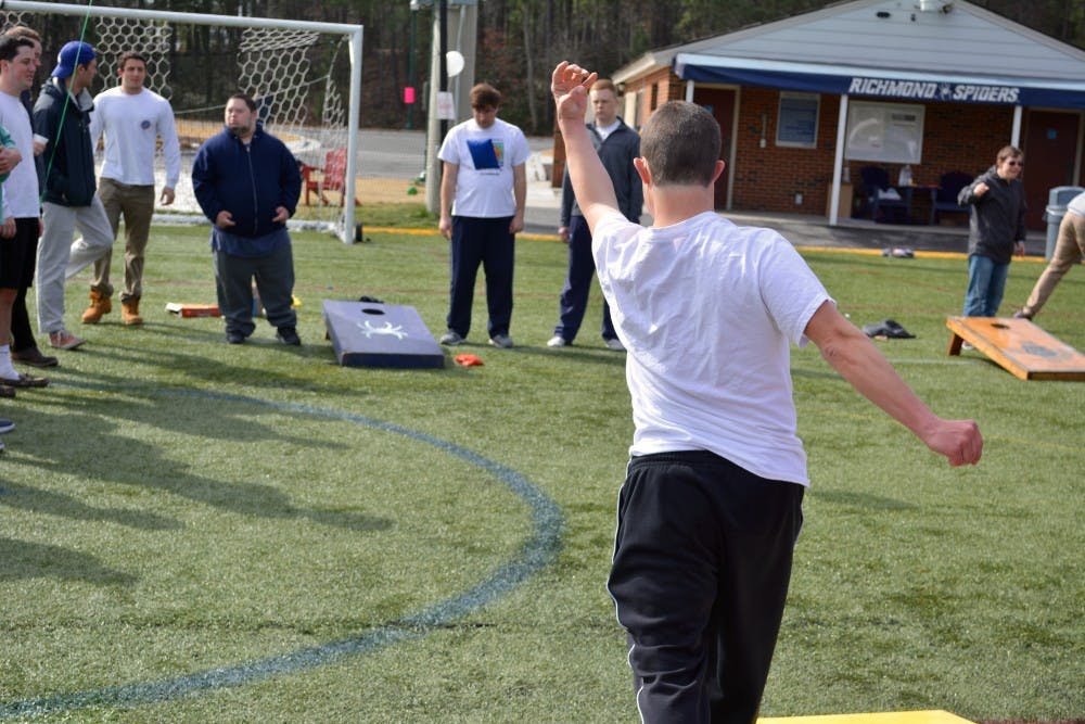 Event-goers took place in a variety of games, like corn hole.