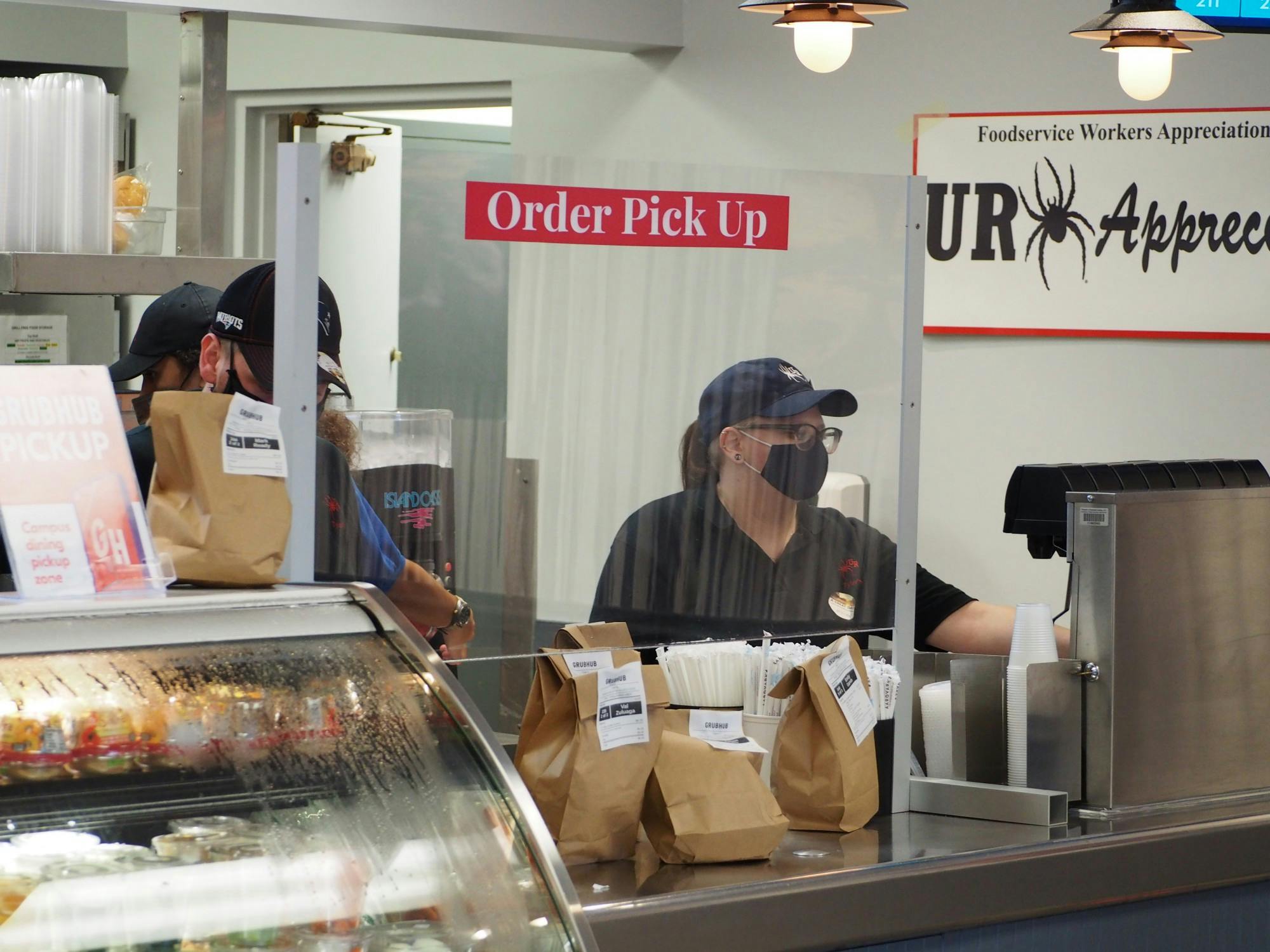 Online food orders accumulate on the counter of Tyler's Grill.