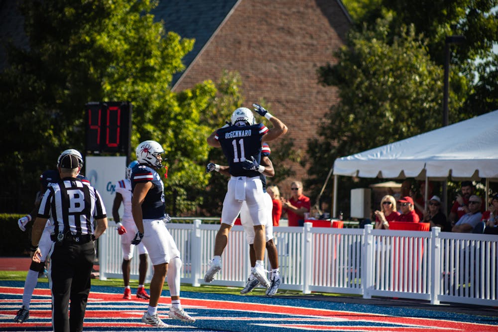<p>Wide Receiver Nick DeGennaro celebrates a touchdown during the University of Richmond's 38-6 win over Delaware State on Sept. 16 at Robins Stadium. Photo by Joseph Jeon.</p>