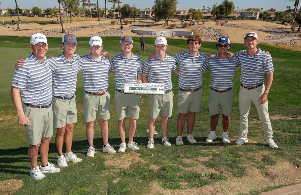 The UR men's golf team accepting first place at the Loyola Invitational. Courtesy of Richmond Athletics