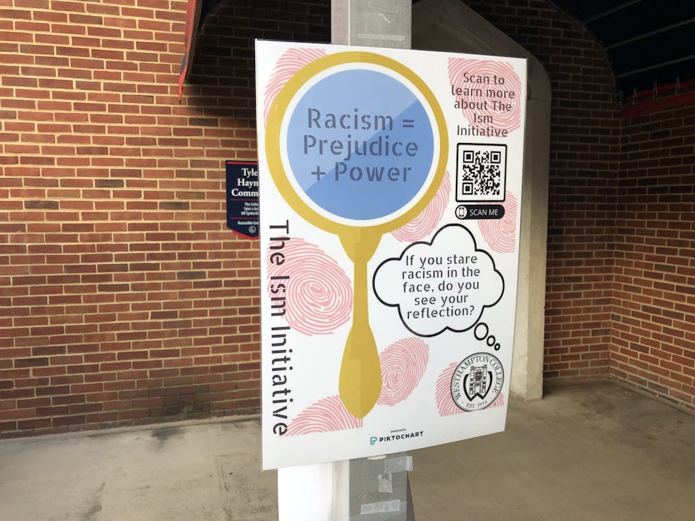<p>An -Ism Initiative poster hangs outside the Tyler Haynes Commons.</p>