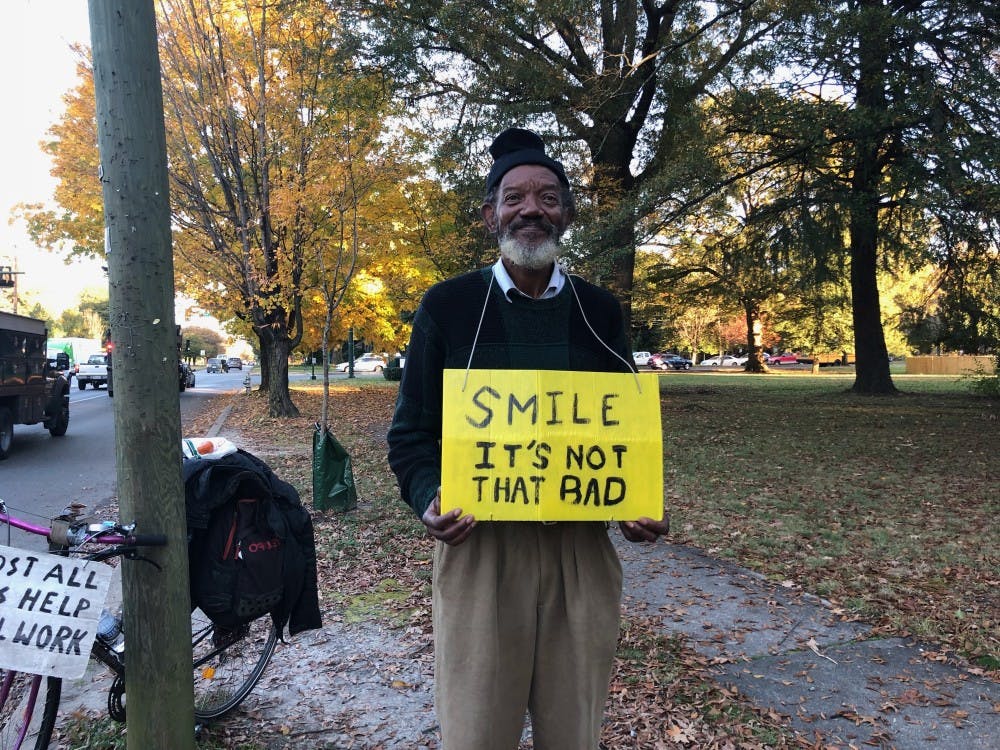 <p>John holds this sign outside on the corner of West Laburnum Avenue and Brook Road for about nine hours every day.</p>