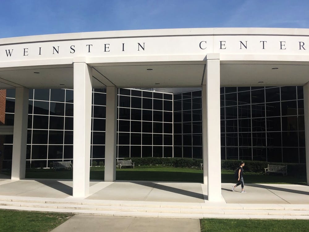 A student walks out of the Weinstein Center for Recreation and Wellness.