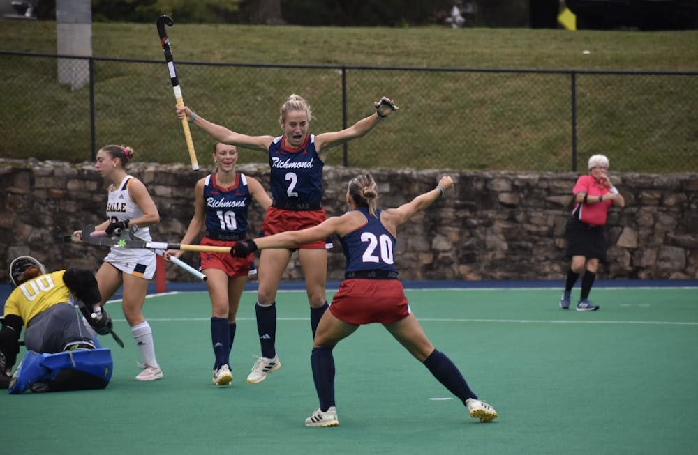 First-year forward Margaret Scheurer celebrating her first career goal with junior midfielder Lainey Nichols and sophomore forward Clara Larripa. 