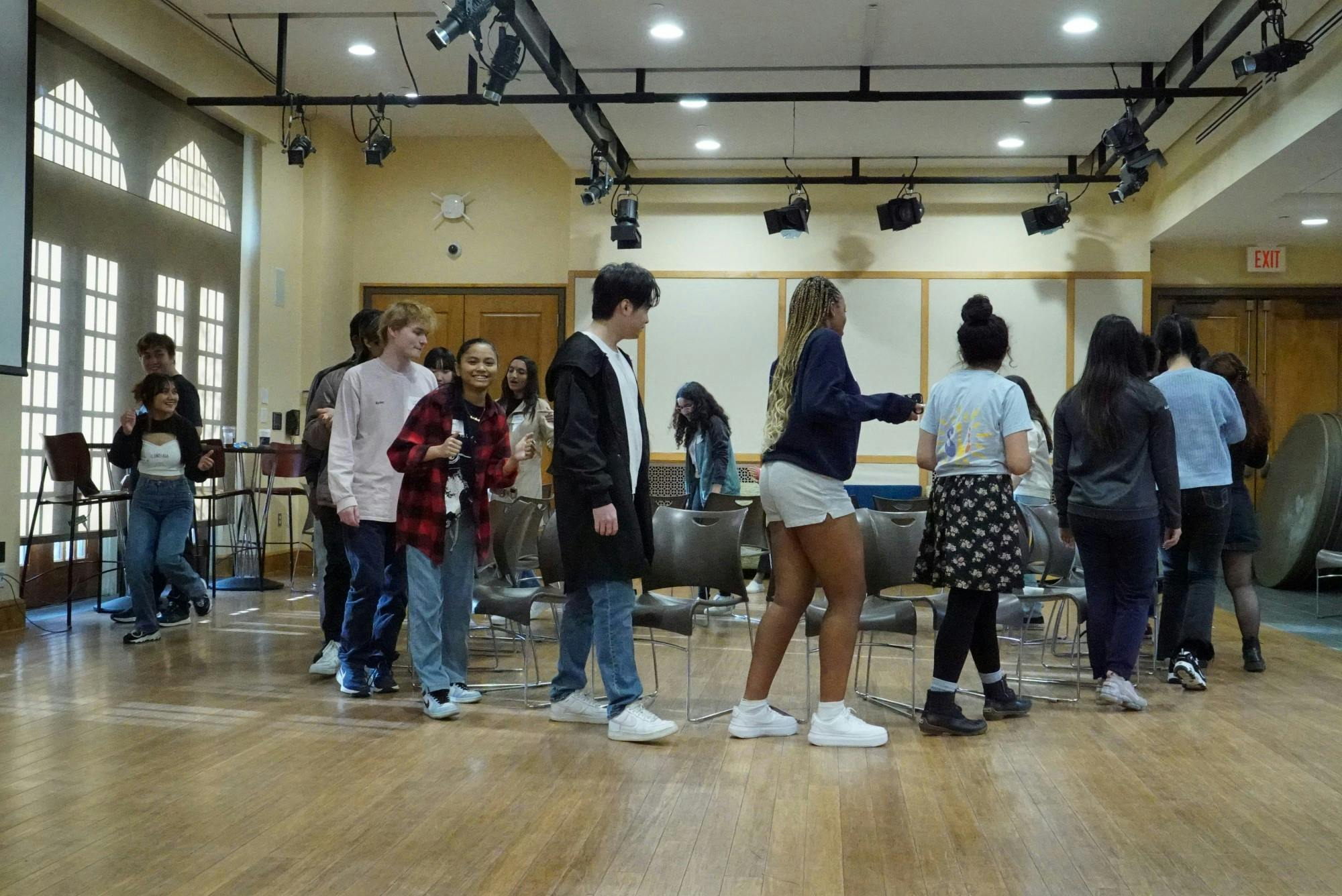 International students participate in musical chairs at the Spiders Around the Globe social event on March 18 at the Office of International Education.&nbsp;