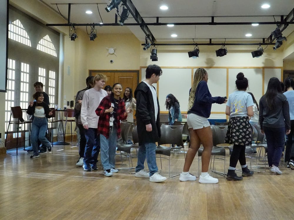 International students participate in musical chairs at the Spiders Around the Globe social event on March 18 at the Office of International Education.&nbsp;