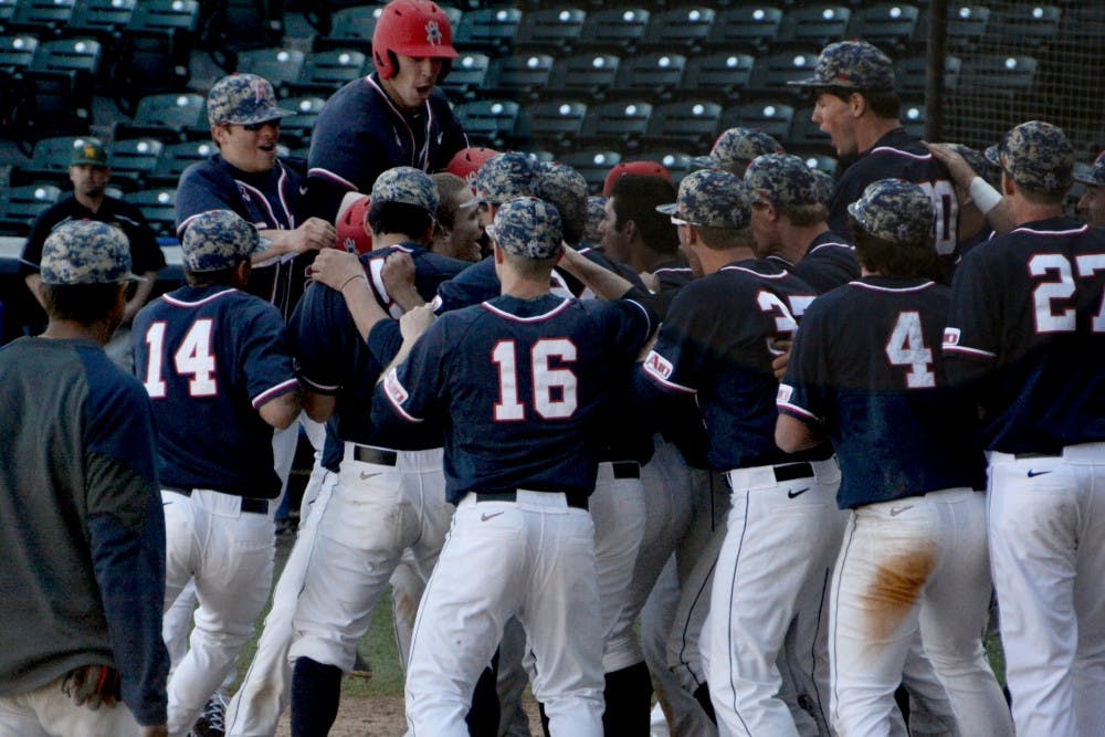 <p>The Richmond baseball team celebrated Michael Morman's walk-off grand slam in the bottom of the 10th inning in the first game of the doubleheader on Saturday. </p>
