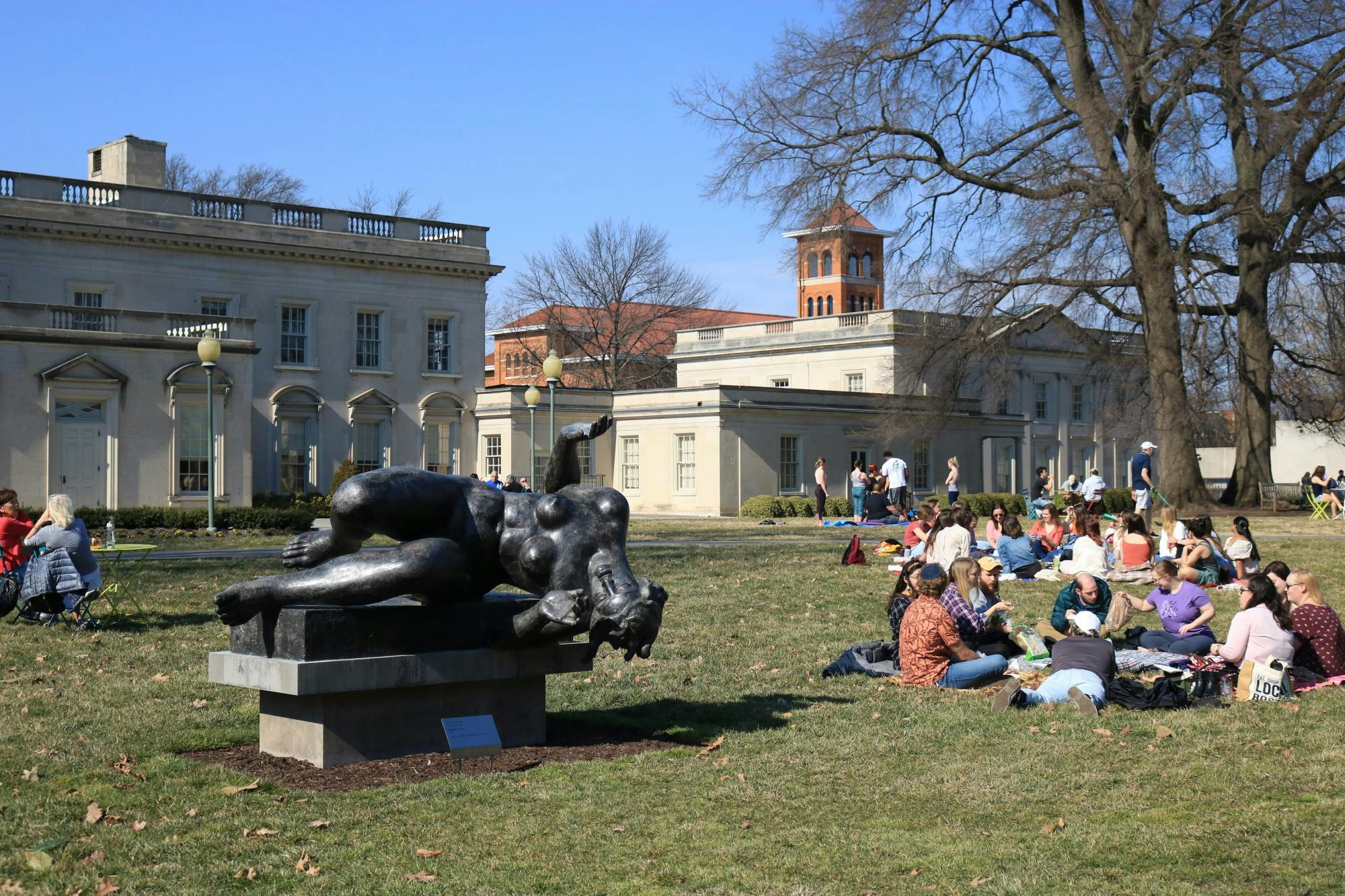 People sitting on the lawn of the Virginia Museum of Fine Arts.