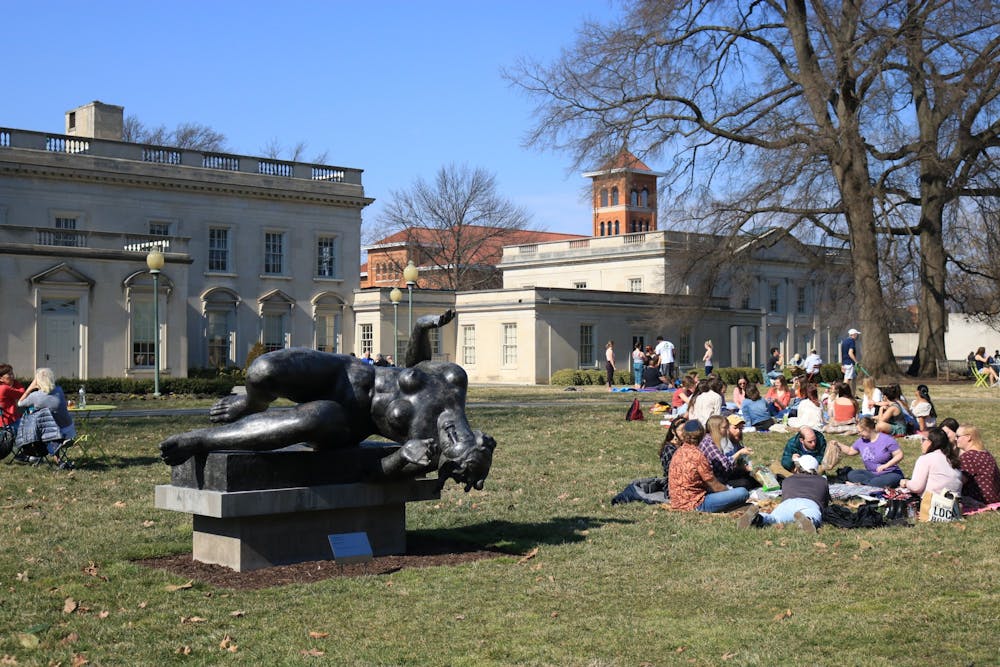 <p>People sitting on the lawn of the Virginia Museum of Fine Arts.</p>