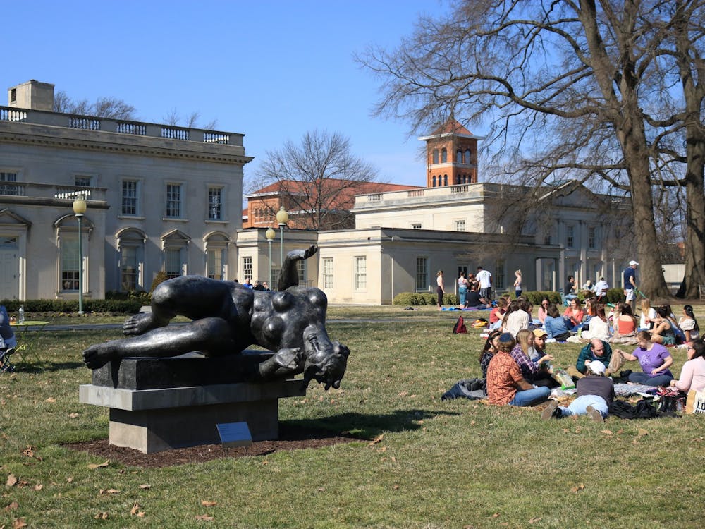 People sitting on the lawn of the Virginia Museum of Fine Arts.