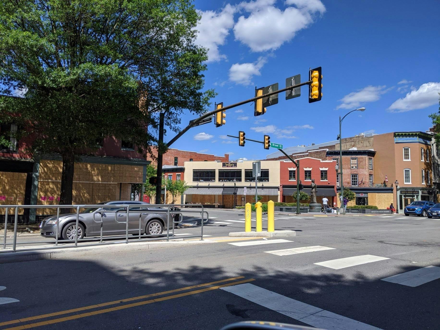 Boarded storefronts on West Broad Street on May 31 near the statue of Maggie L. Walker.&nbsp;