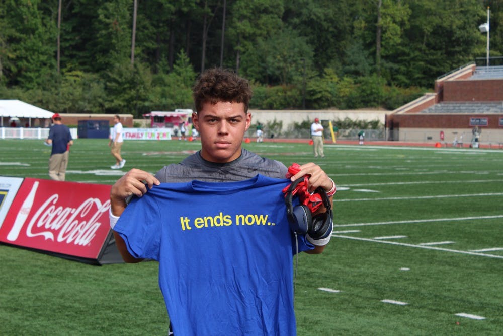 Jacob Roberson, a sophomore, warmed up for today's football game with&nbsp;an "It ends now" t-shirt tucked into the back of his pant.&nbsp;