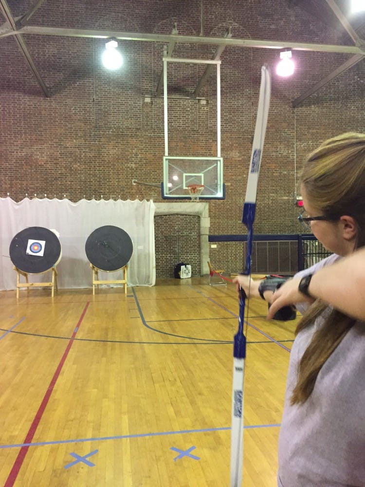 Tess Ferrer aims at a target from a distance of about 8 meters.&nbsp;
