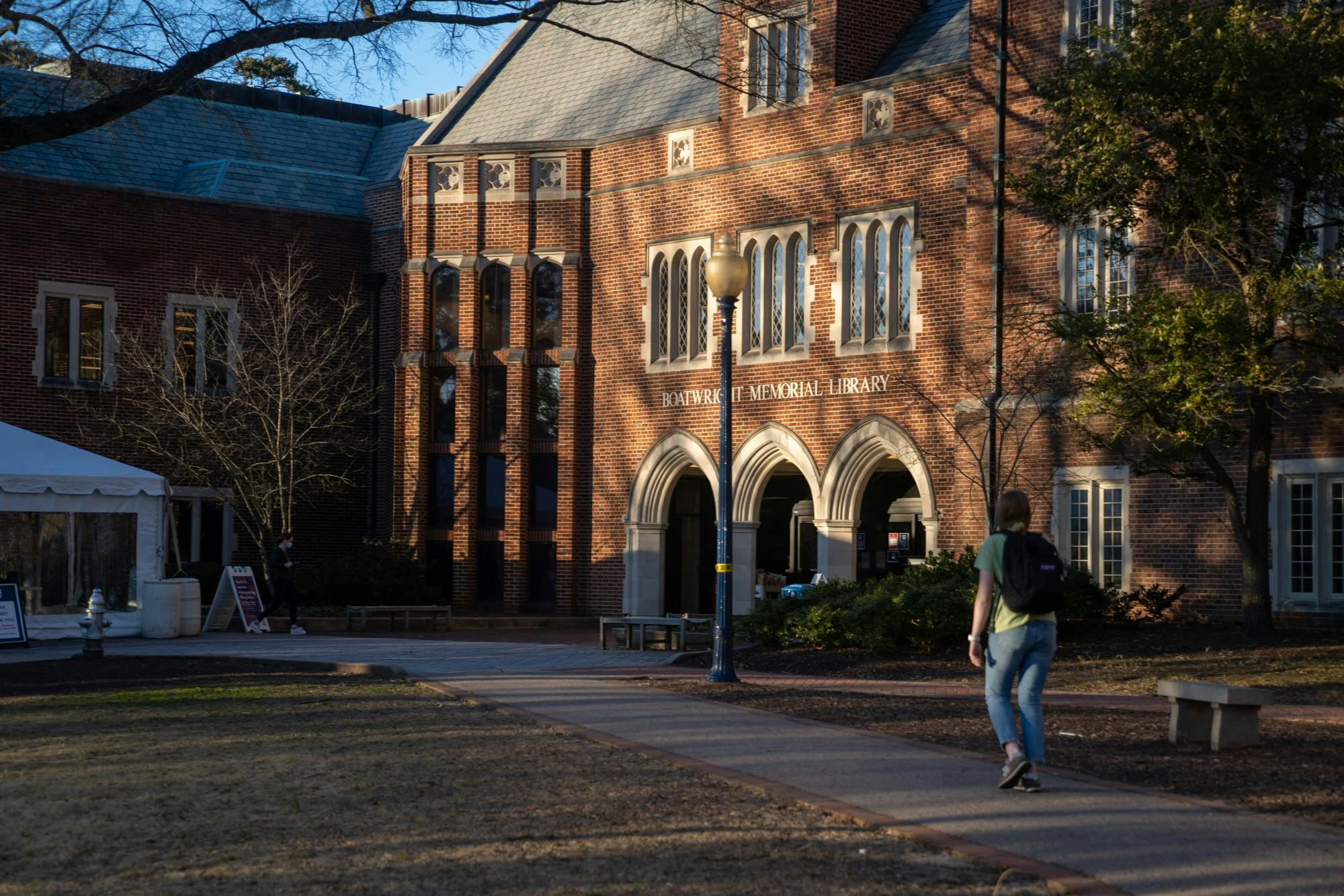 Students march into Boatwright Memorial Library.