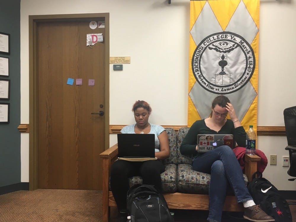 Nia Carter and Rennie Harrison work while waiting for Fabian.