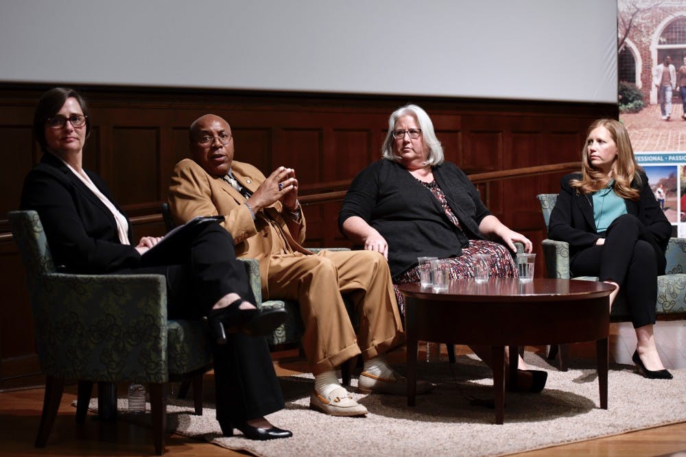 <p>Mary Kelly Tate (left), Thomas Haynesworth, Janet Burke and Shawn Armbrust listen to an audience question during the Conversation on Wrongful Convictions and Reconciliation in Ukrop Auditorium. &nbsp;</p>