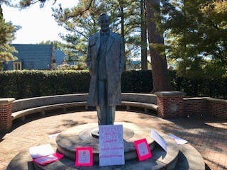 Members of Planned Parenthood Generation Action placed posters on the E.Claiborne Robins statue on October 19, 2017 as part of a demonstration.