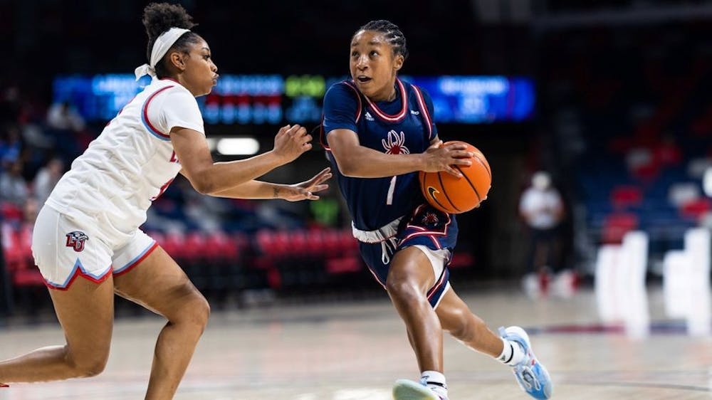 Junior guard Grace Townsend runs past Liberty University's defense at the team's first game of the season on Nov. 7. Photo courtesy of Richmond Athletics.