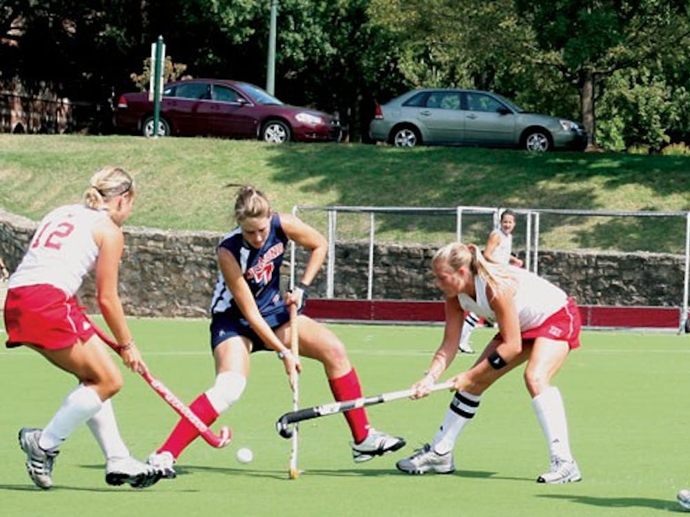 During Women's Field Hockey game versus Miami University Dani Pycroft who is a junior player attempts to pass the ball and Sarah Blythe-Wood  who is a senior players assits Dani's playing. 