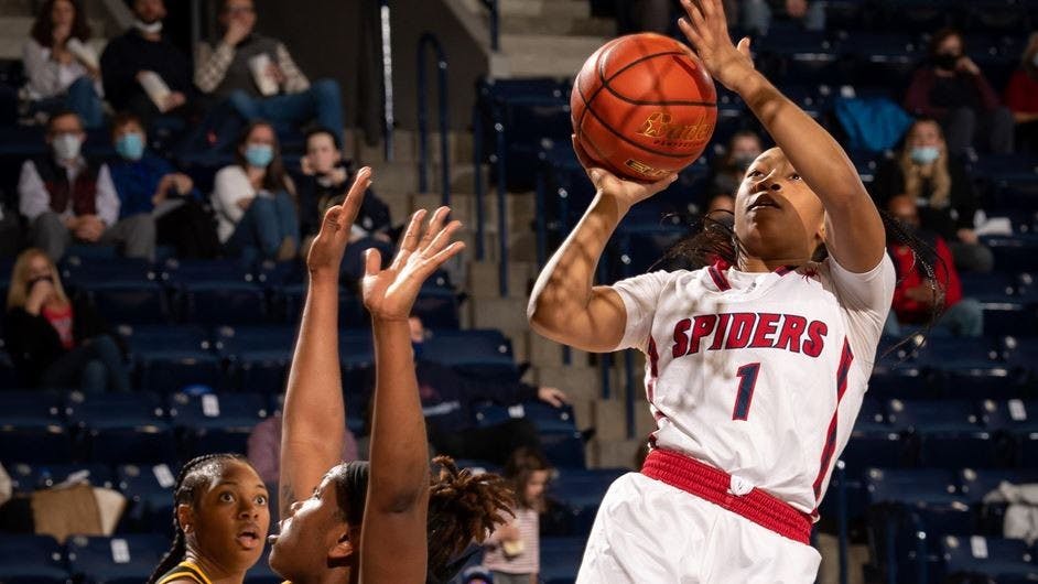 &nbsp;Sophomore guard Grace Townsend jumps over a Virginia Commonwealth University player at the game on Wednesday evening at the Robins Center. Photo courtesy of Richmond Athletics.
