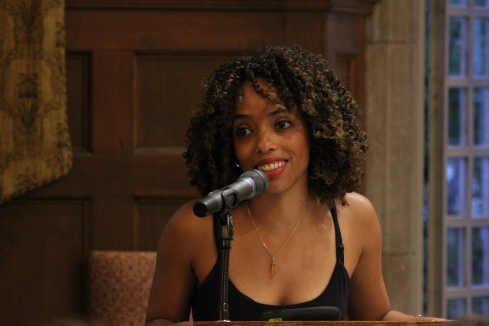 Activist and educator Dena Simmons addresses a full crowd in the Brown Alley Room.