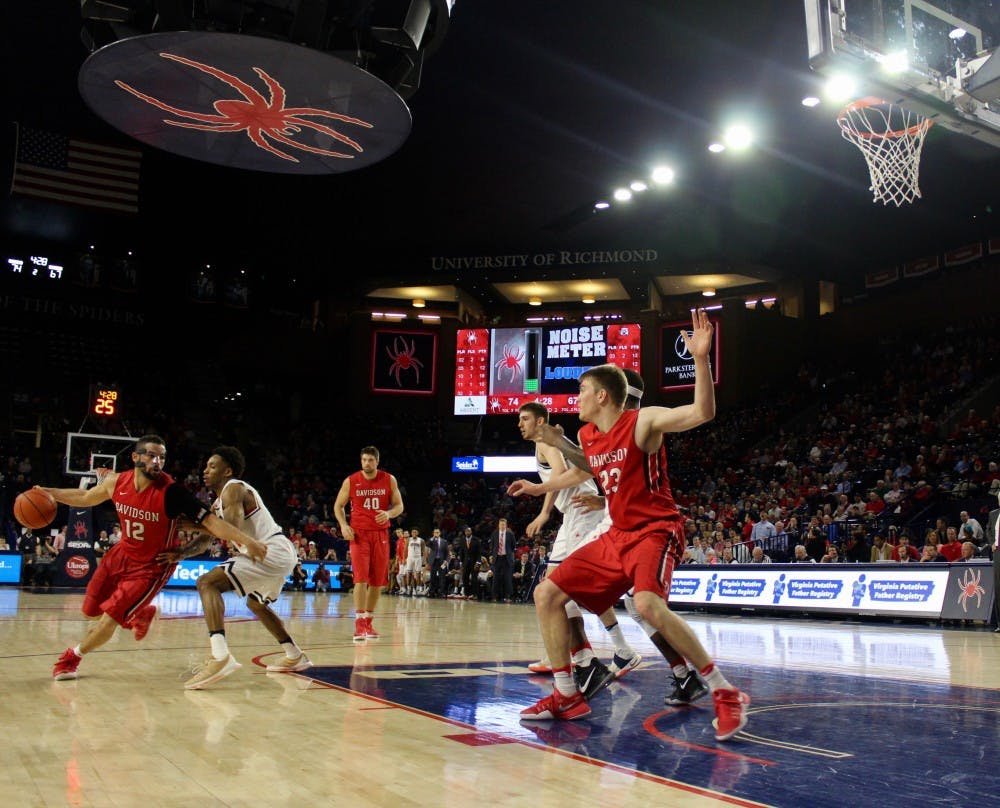Davidson guard, Jack Gibbs, drives to the basket in the second period with the Spiders leading by 7.