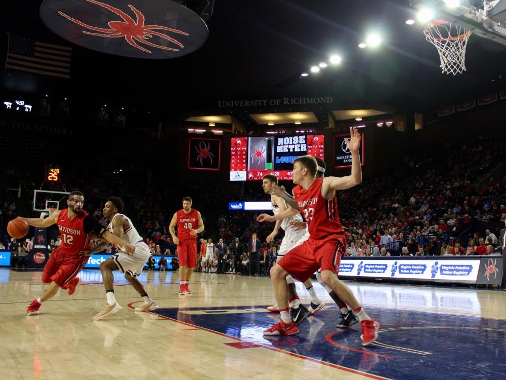 Davidson guard, Jack Gibbs, drives to the basket in the second period with the Spiders leading by 7.