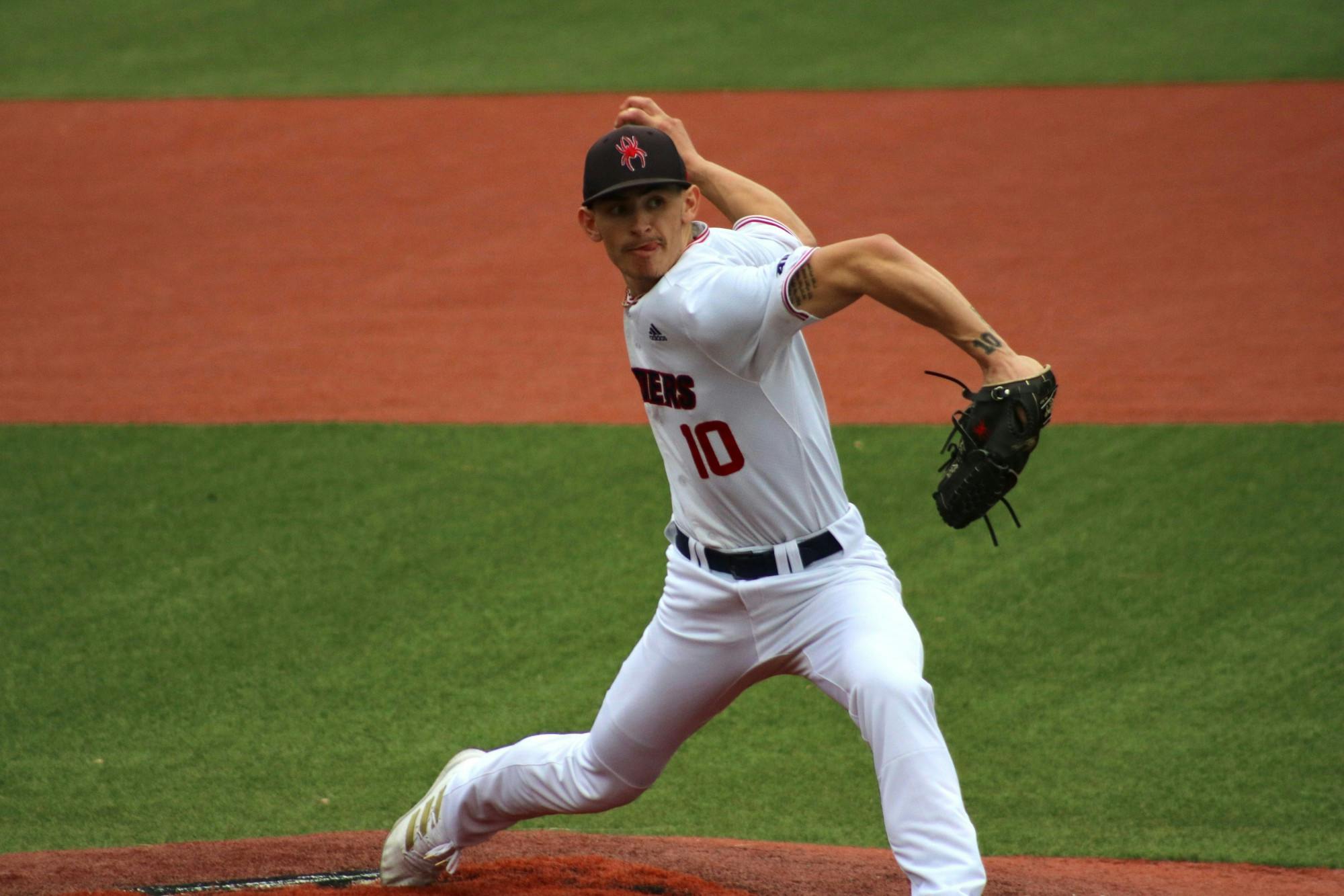 Junior Jacob Marcus pitches to College of William &amp; Mary at home opener on Feb. 22.