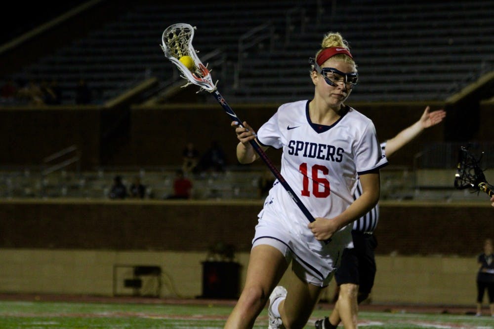 <p>Carolyn Chambers cradles the ball.</p>