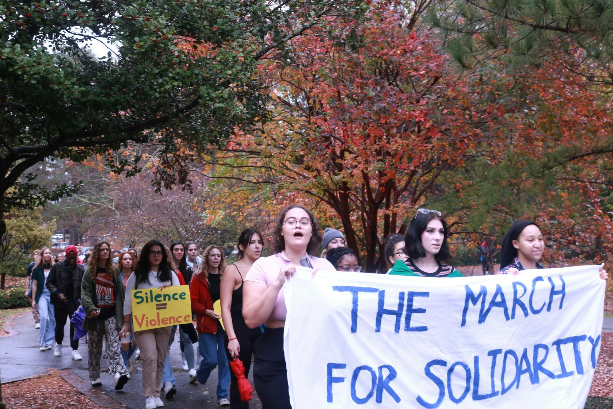 Junior and organizer Jordan Jones (front left) helps lead the march on Nov. 11.