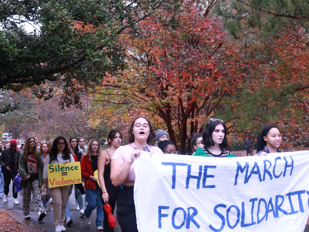 Junior and organizer Jordan Jones (front left) helps lead the march on Nov. 11.
