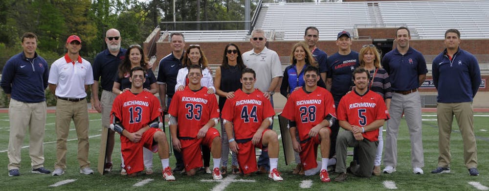 <p>Seniors, their families and coaches pose for a senior day picture. Photo courtesy of Richmond Athletics. </p>