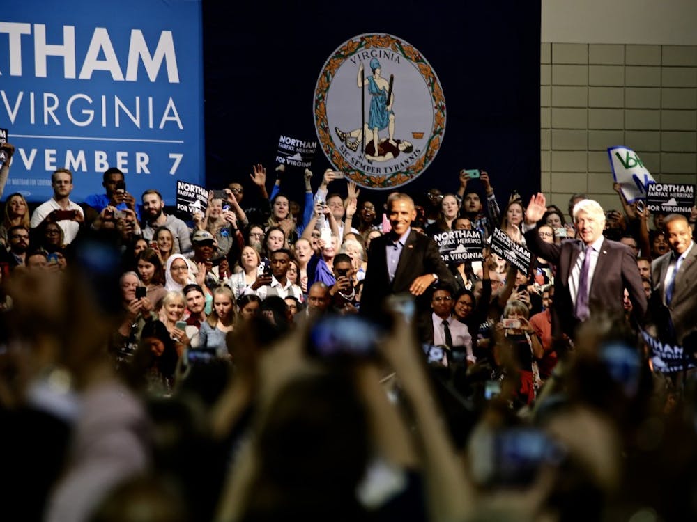 A cheering crowd welcomes former President Barack Obama at the Richmond Convention Center during a rally for Ralph Northam, Democratic gubernatorial candidate. Photo by Erin Moon.