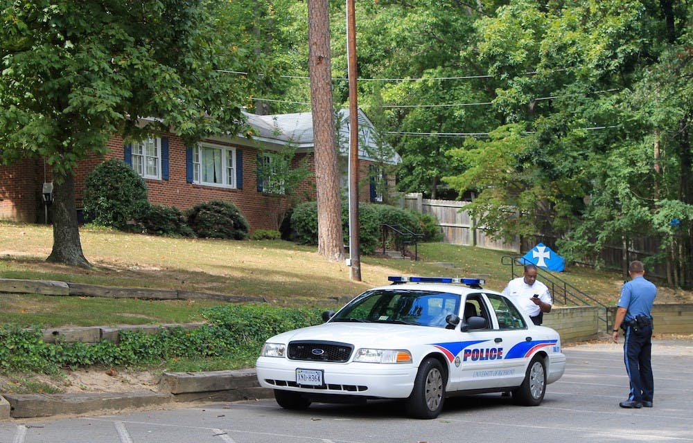 Campus police outside of the Sigma Chi lodge, which raised more than $1,100 via GoFundMe to help replace the stolen equipment.