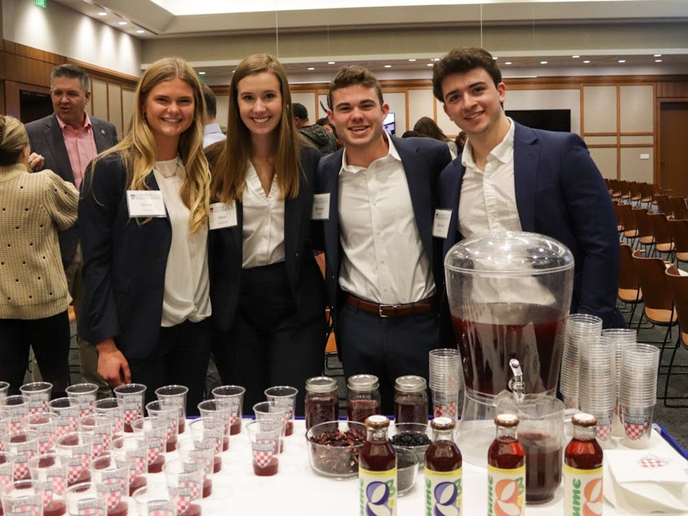 From left to right junior Grace Clarke, senior Sarah Edwards, Brendan Fowler and Chris Conte. The Lume co-founders pose with samples of their energizing tea at The Great Bake Off on Nov. 16.