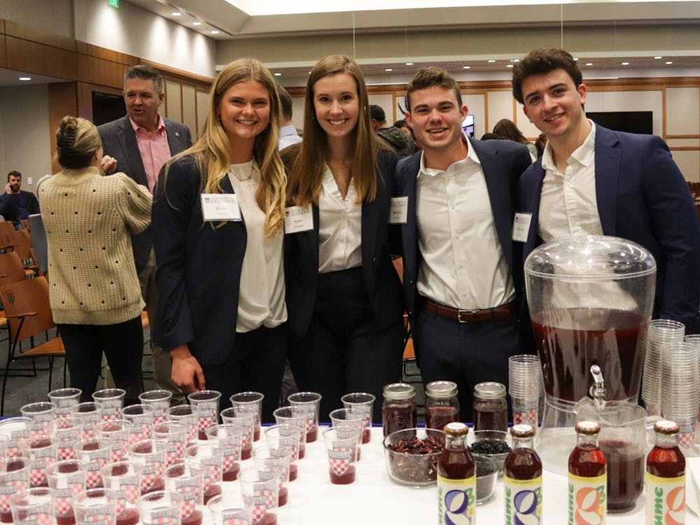 From left to right junior Grace Clarke, senior Sarah Edwards, Brendan Fowler and Chris Conte. The Lume co-founders pose with samples of their energizing tea at The Great Bake Off on Nov. 16.