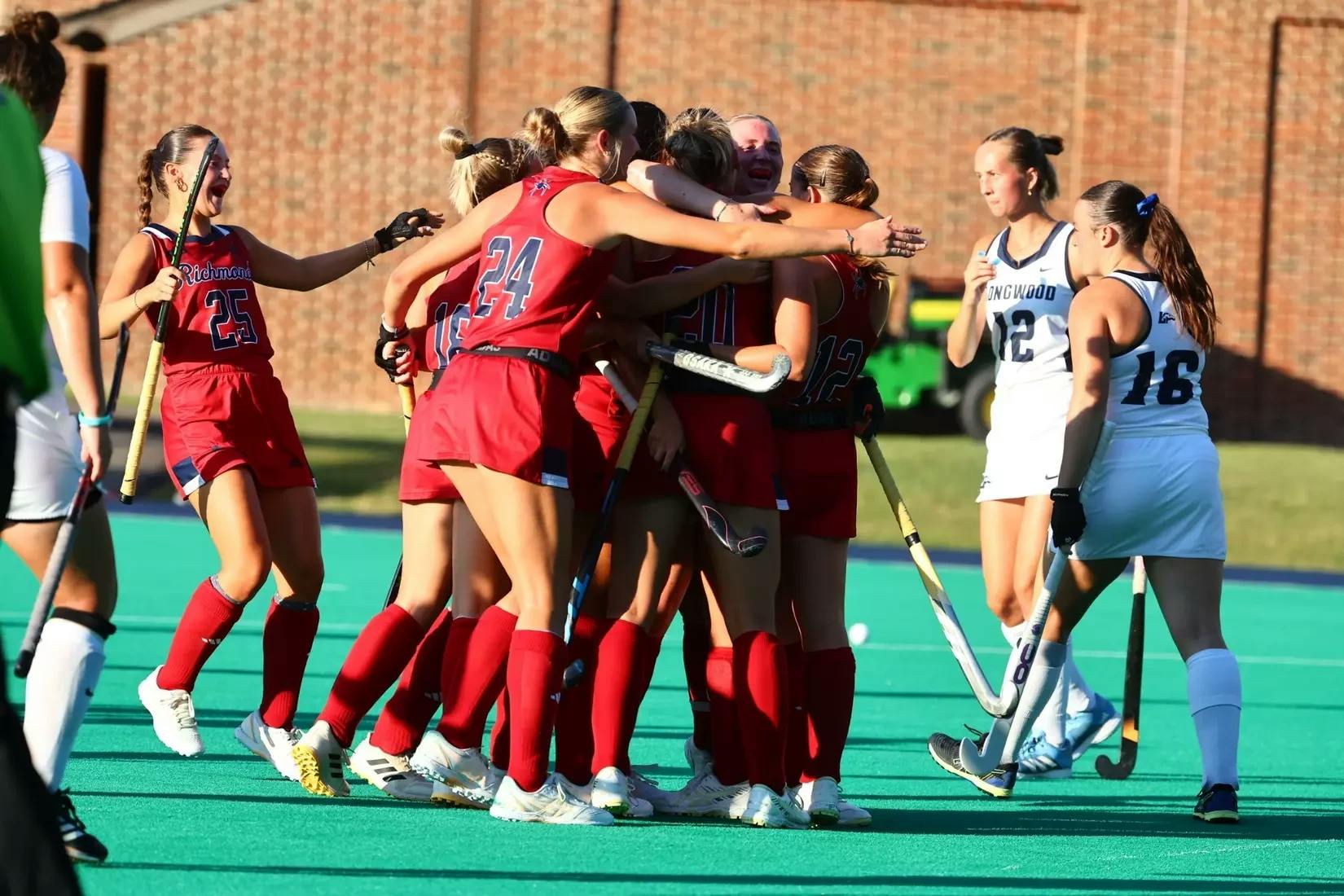 The University of Richmond field hockey team celebrates at a game where the team notched its first win of the season against Longwood University. Courtesy of Richmond Athletics