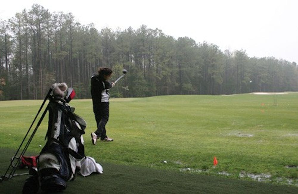 Annie Sprick, '11, practices at the golf team's facilities Tuesday afternoon.  The women's golf team is in Georgia this weekend for the CAA Championship.