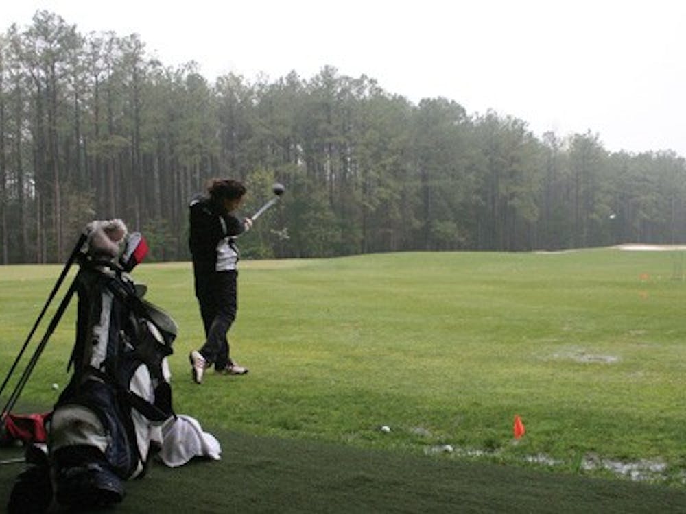 Annie Sprick, '11, practices at the golf team's facilities Tuesday afternoon.  The women's golf team is in Georgia this weekend for the CAA Championship.