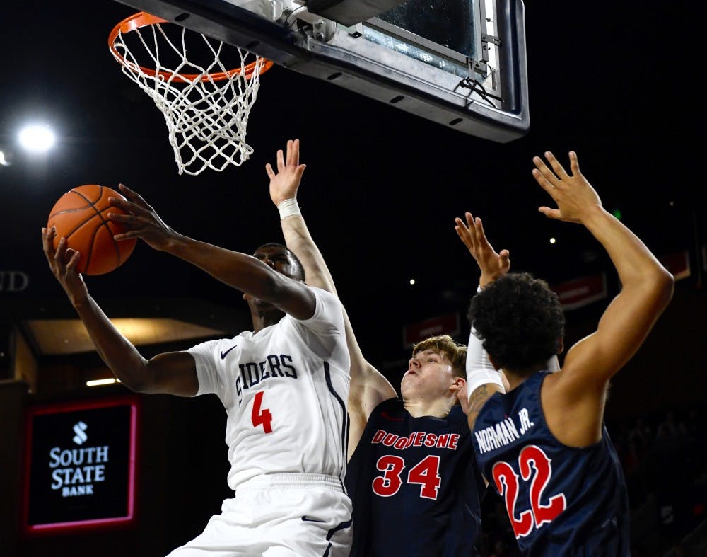 Sophomore Nathan Cayo goes for a layup Wednesday, Jan. 16 in a loss against Dusquene.&nbsp;
