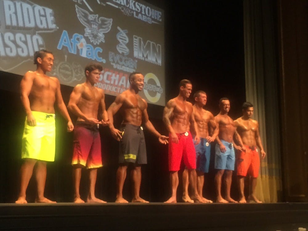 The men's physique class emphasized muscle in all areas of the body as well, though not to the same extent as the male bodybuilders.