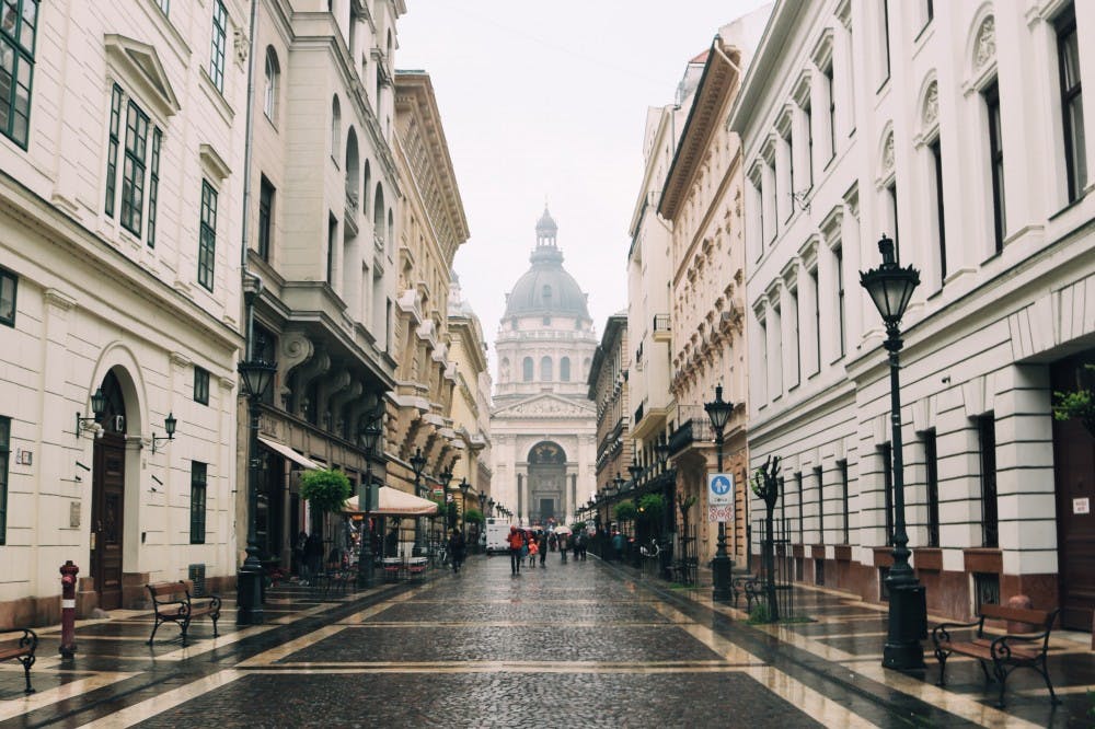 On Szent István tér, a brick square, walking toward Szent István Bazilika in Budapest, Hungary.