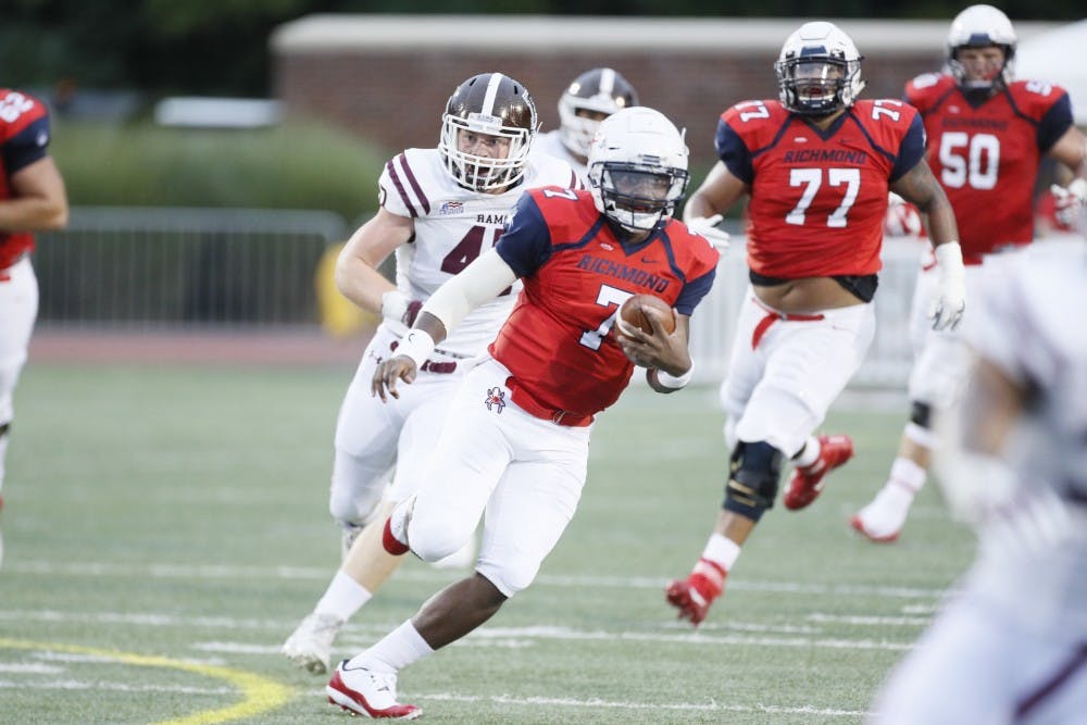 Spider quarterback and junior&nbsp;Kevin Johnson (7) runs for a touchdown against&nbsp;Fordham Saturday night in the UR home opener.&nbsp;