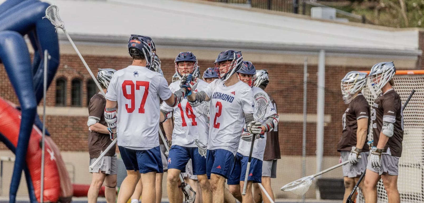 Junior midfielder Jack Dougherty, first-year midfielder Harrison Voelzke, and sophomore attacker Luke Meyer celebrating a goal. Courtesy of Richmond Athletics 